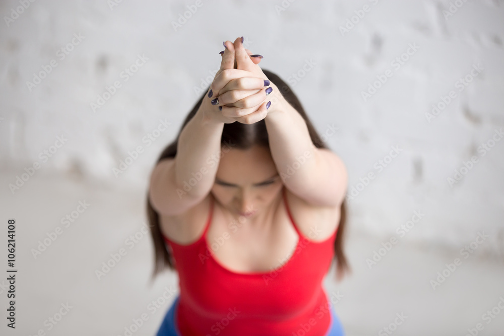 Fototapeta premium Yoga indoors: Virabhadrasana 1 Pose