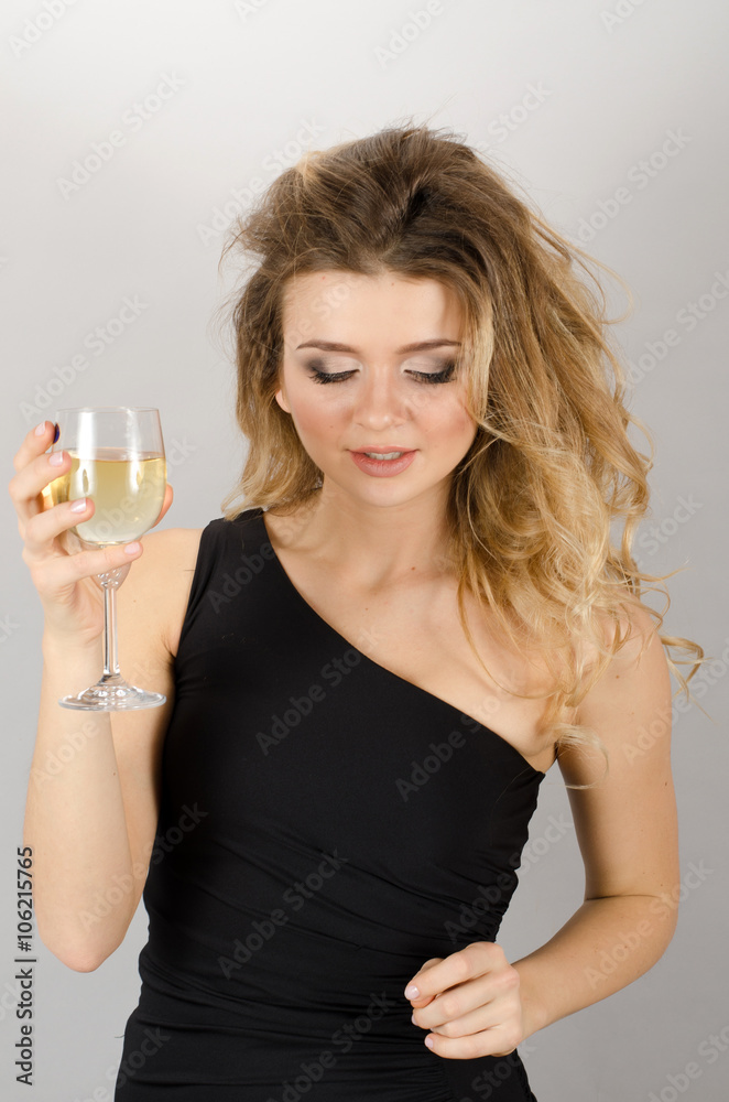 Beautiful blond woman drinking white wine Beautiful blond woman drinking white wine