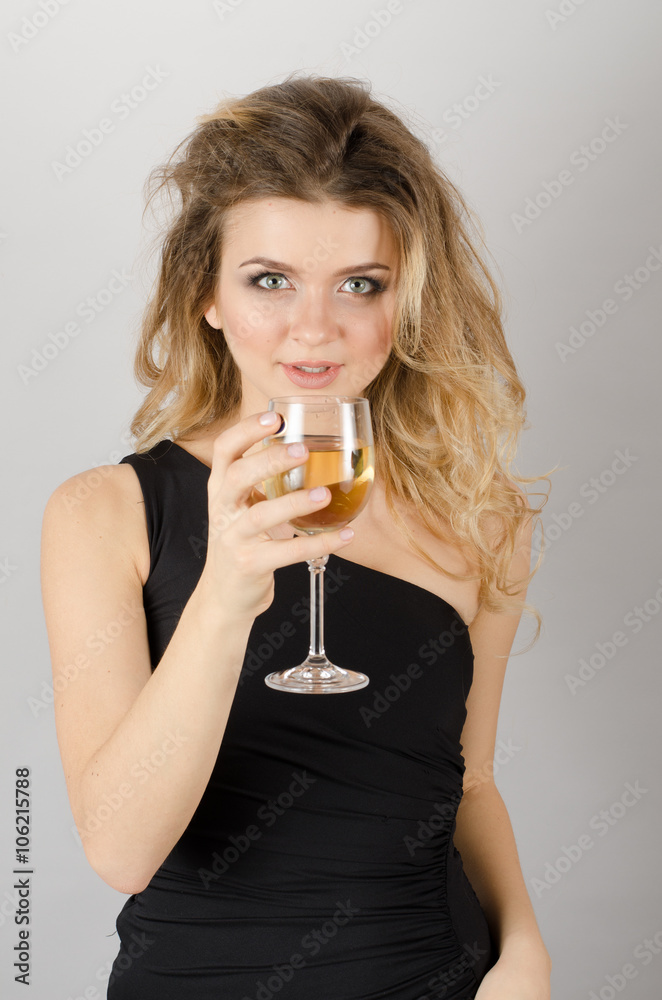 Beautiful blond woman drinking white wine Beautiful blond woman drinking white wine