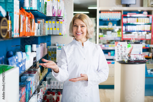 Pharmacists working in modern farmacy photo