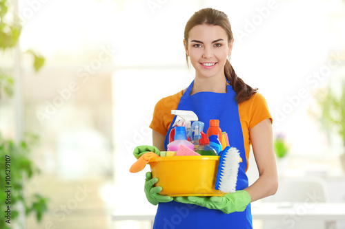 Woman in rubber gloves hold...