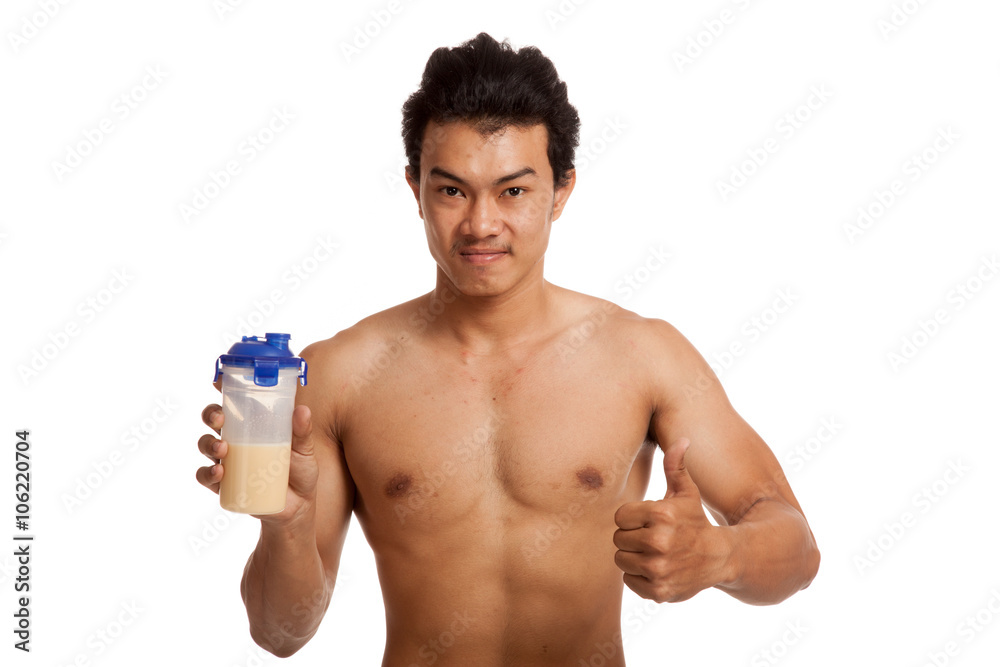 Muscular Asian man thumbs up with whey protein Muscular Asian man thumbs up with whey protein