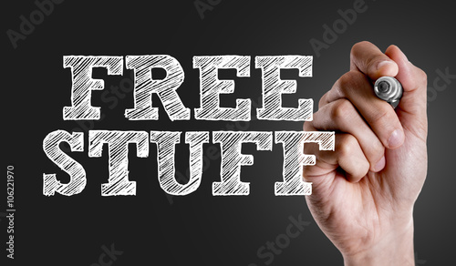 Hand writing the text: Free Stuff
