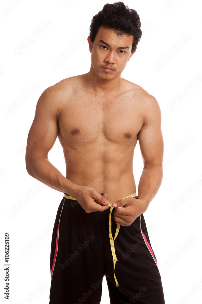 Muscular Asian man with measuring tape Muscular Asian man with measuring tape