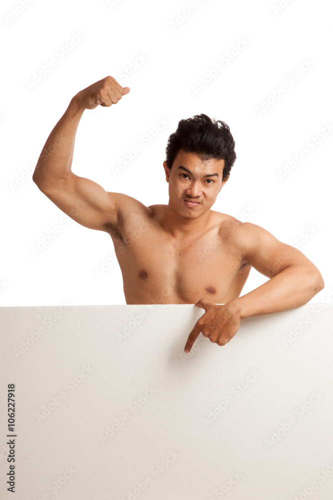 Muscular Asian man point down flexing biceps behind blank sign Muscular Asian man point down flexing biceps behind blank sign