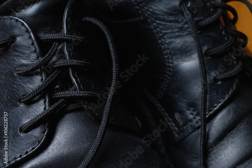 Black shoes lacing. Macro.