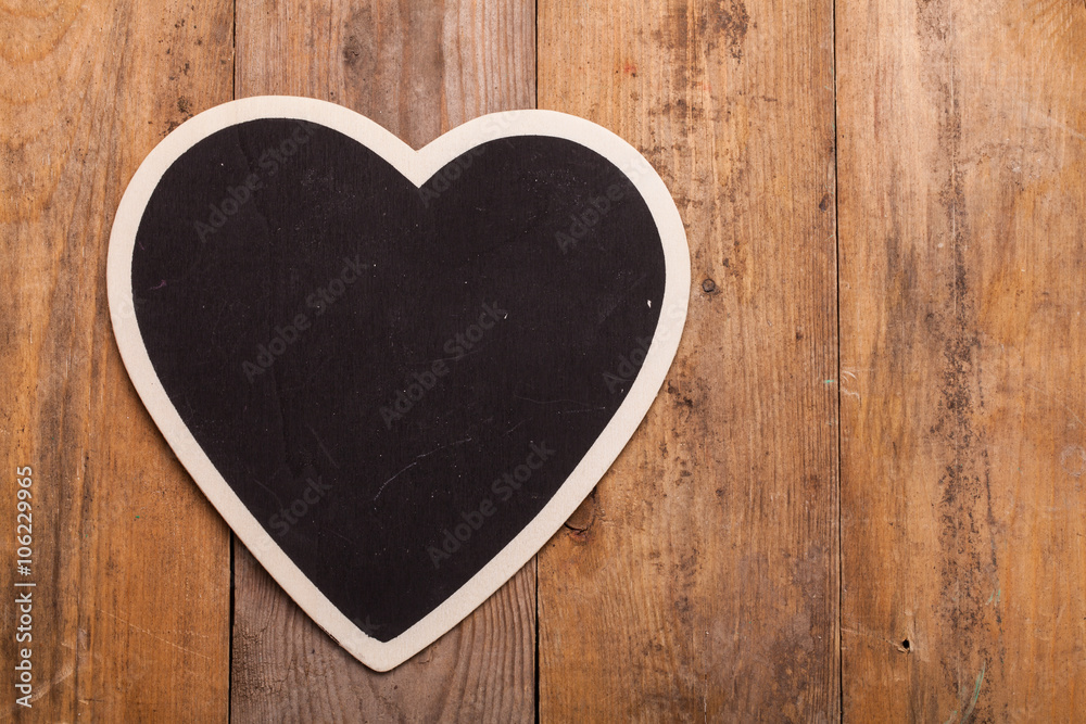 black heart on wood background black heart on wood background