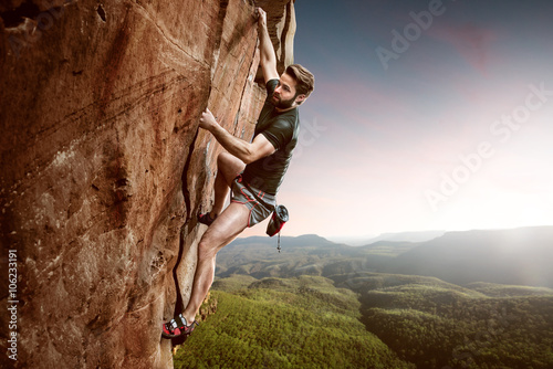 Climber on a cliff photo