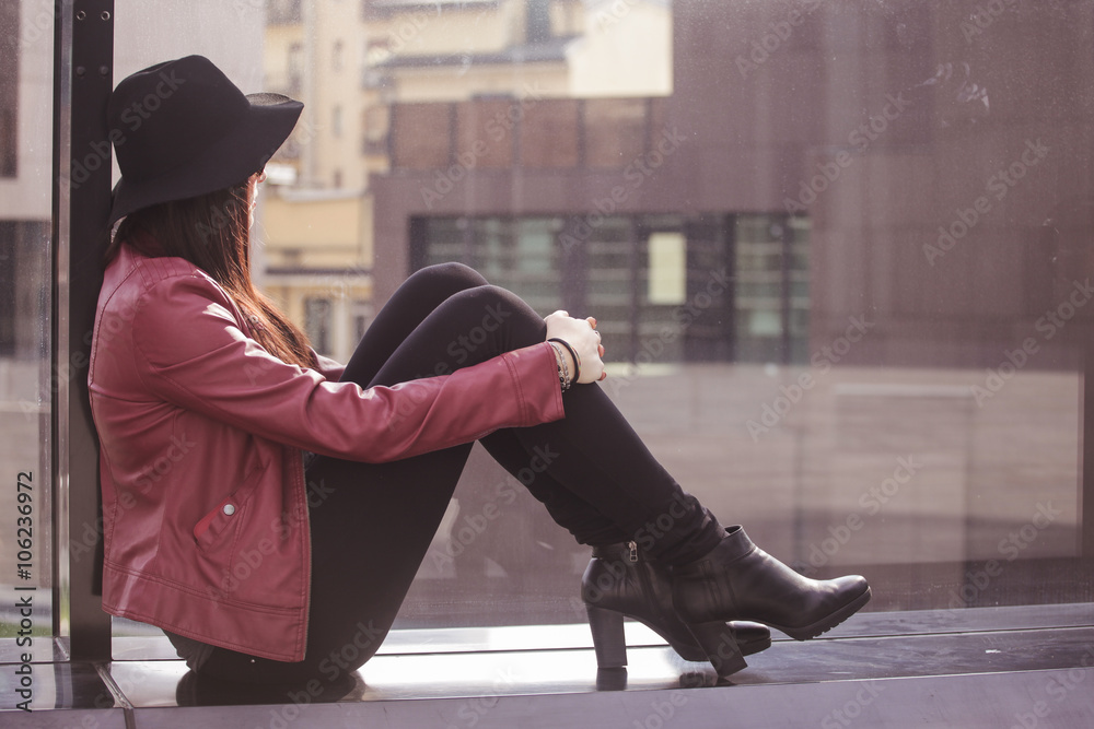 Fototapeta premium Young beautiful woman relaxing in the city