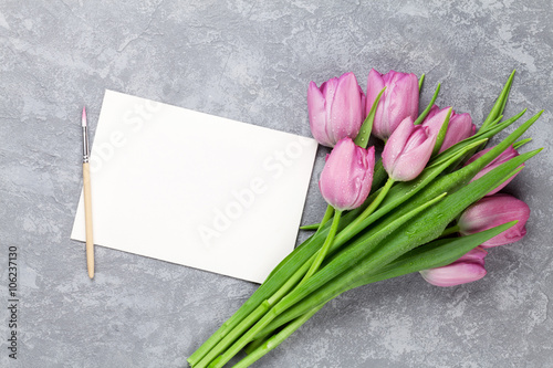 Fresh purple tulip flowers and greeting card