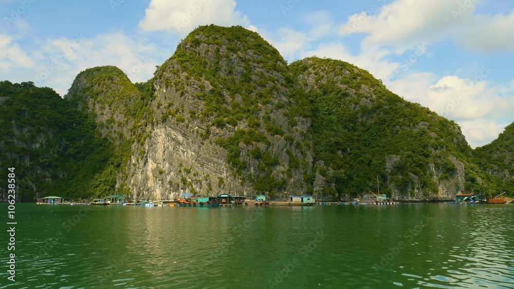 Floating fishing village in halong bay, Vietnam, Asia, beautiful view of limestone islands and traditional Vietnamese houses on water Floating fishing village in halong bay, Vietnam, Asia, beautiful view of limestone islands and traditional Vietnamese houses on water