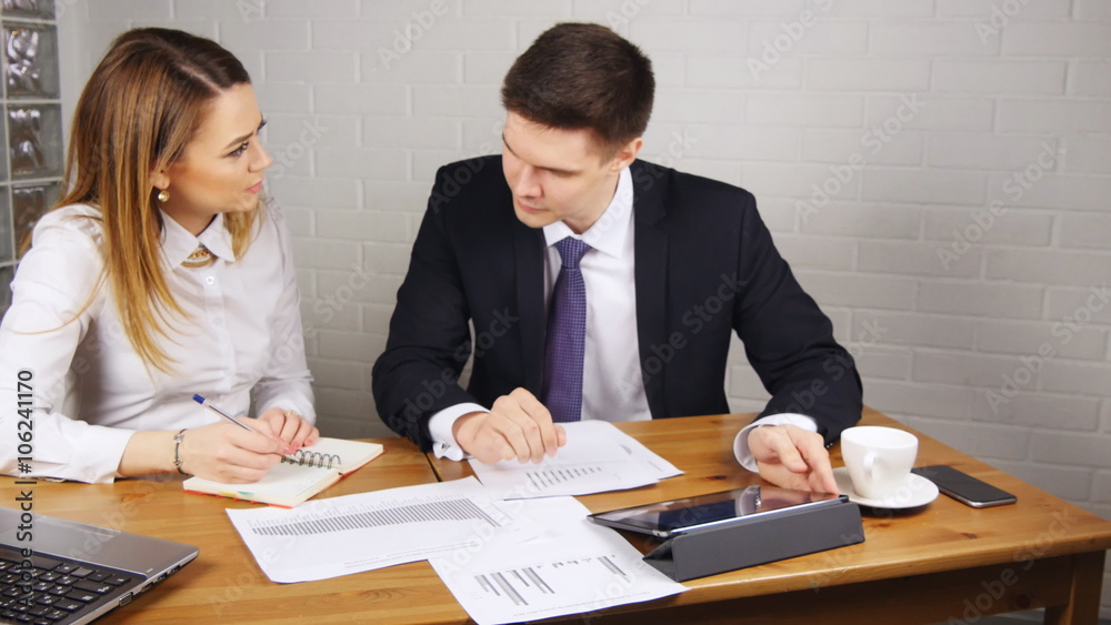 Business people Having Meeting Around Table In Modern Office Business people Having Meeting Around Table In Modern Office