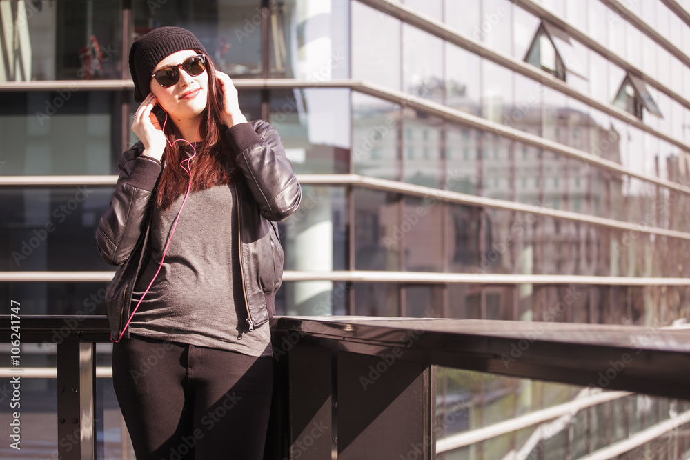 Fototapeta premium Young woman listening to music