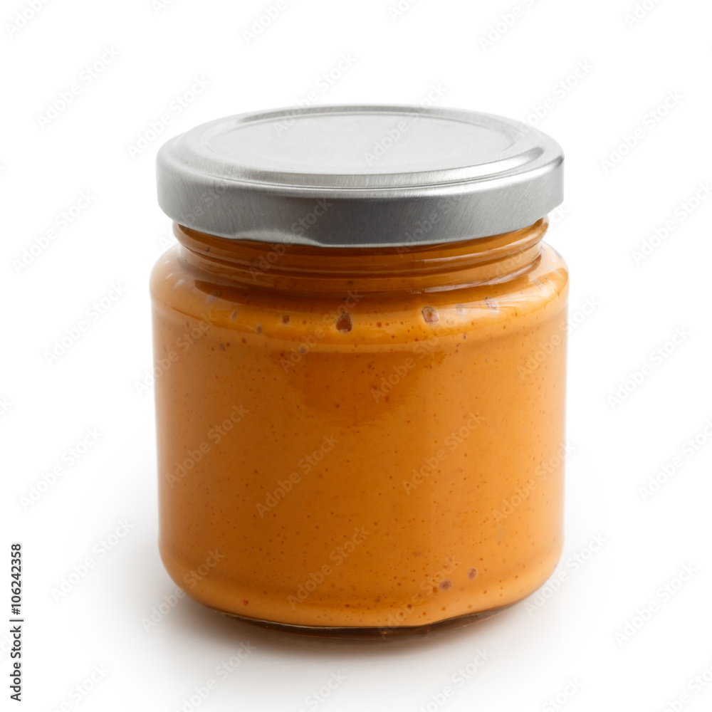 Closed glass jar of tomato and red chilli pepper salsa. Isolated Closed glass jar of tomato and red chilli pepper salsa. Isolated
