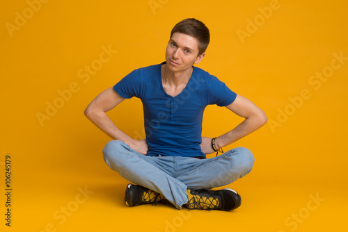 young man sitting on the floor © alexnastya