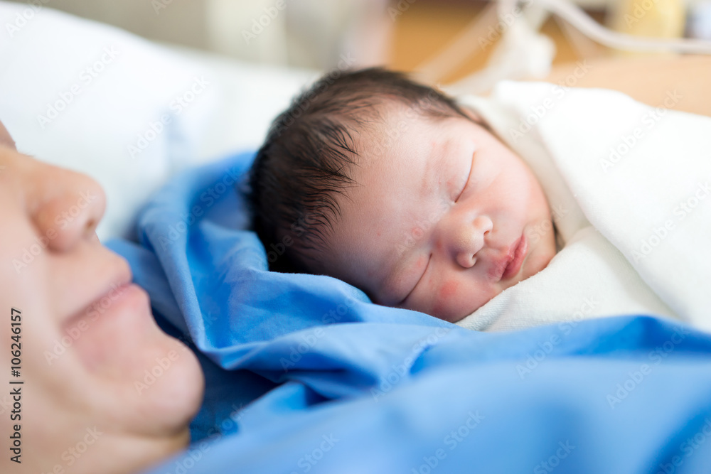 Asian mother with newborn baby in the hospital Asian mother with newborn baby in the hospital