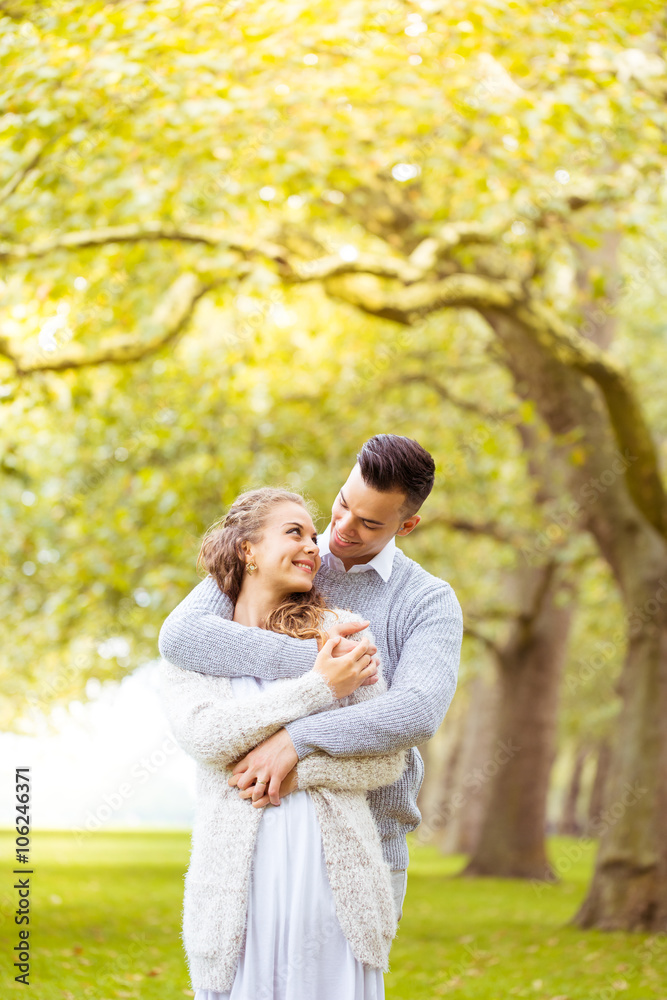 Young couple walking, Hyde Park, London: sunset colour tone