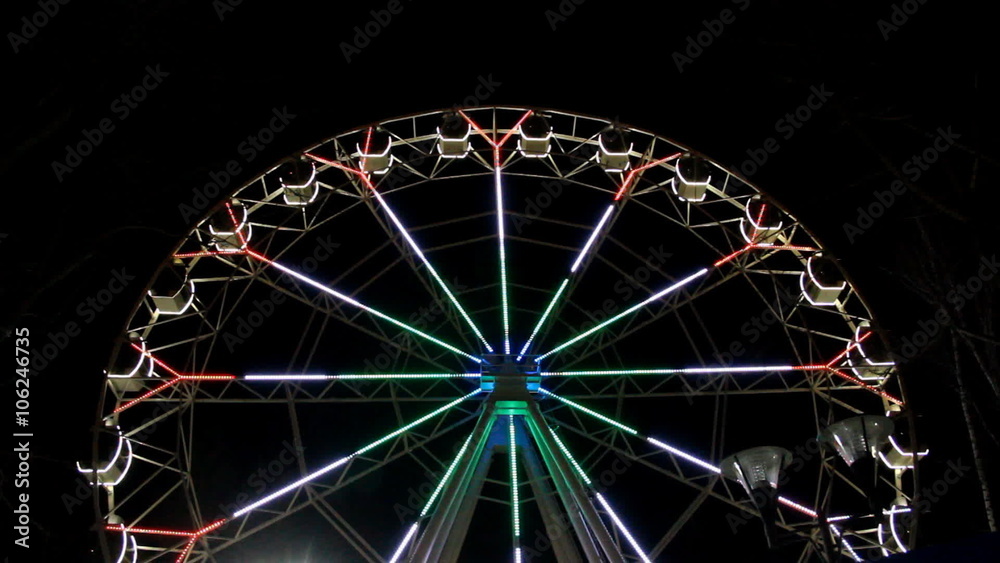 Big colourful illuminated ferris wheel at night in Ufa city Big colourful illuminated ferris wheel at night in Ufa city