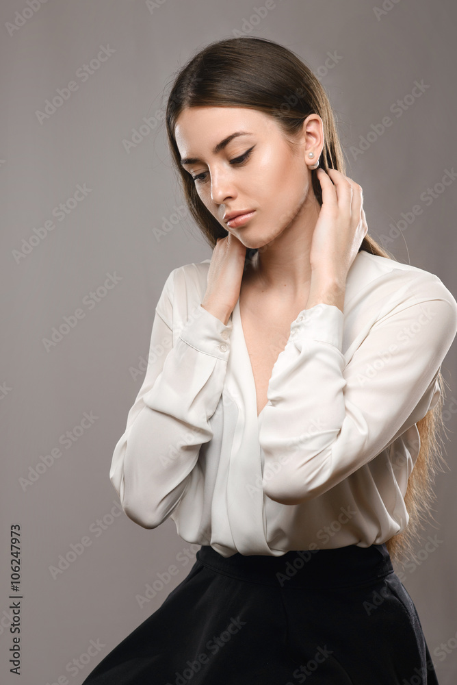 Portrait beautiful girl in white blouse and black skirt Portrait beautiful girl in white blouse and black skirt
