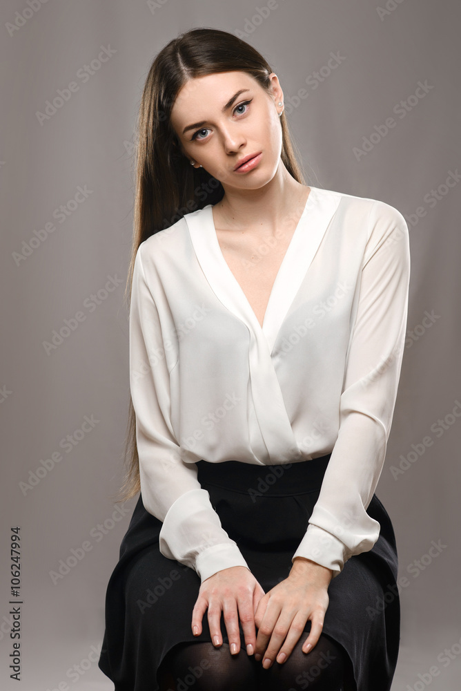 Portrait beautiful girl in white blouse and black skirt Portrait beautiful girl in white blouse and black skirt