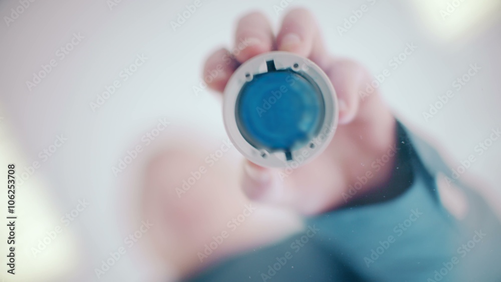 Businessman puts print stamp on office glass table. shoot from below