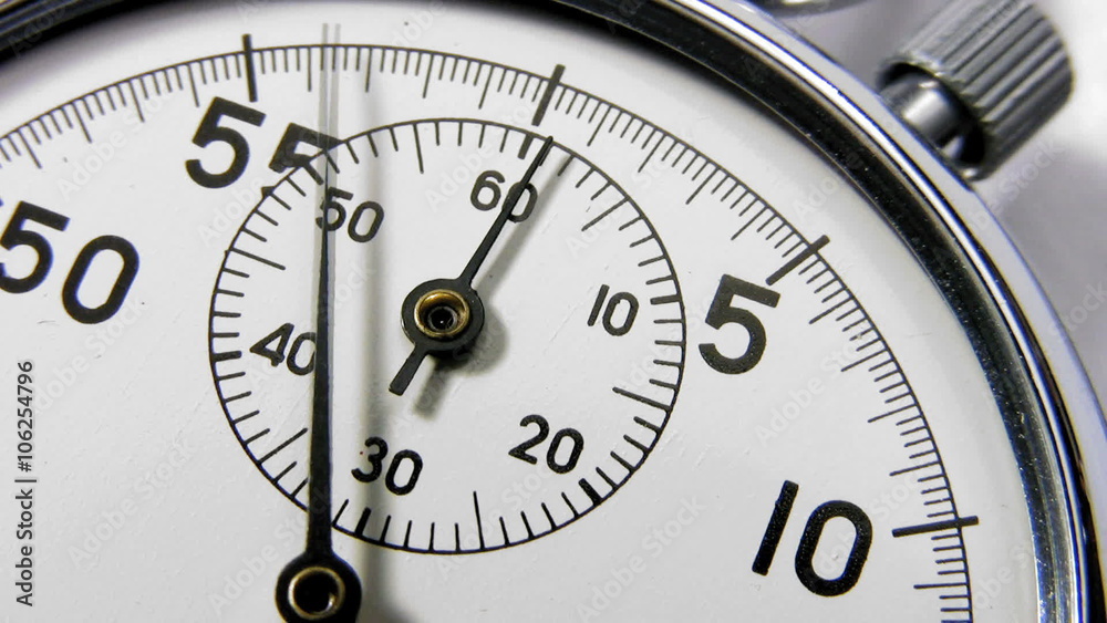 Stopwatch close up of clock face dial and hands Stopwatch close up of clock face dial and hands