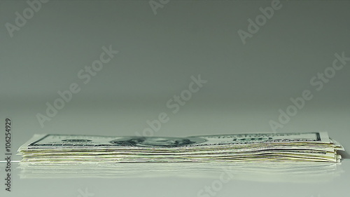 Closeup of a Male Hands Count Hundred Dollar Bills at a Table Fast