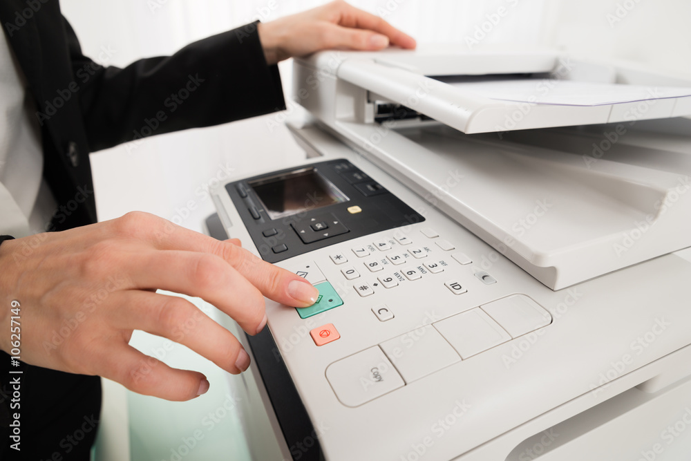 Businesswoman Hand Pressing Printer's Button Businesswoman Hand Pressing Printer's Button