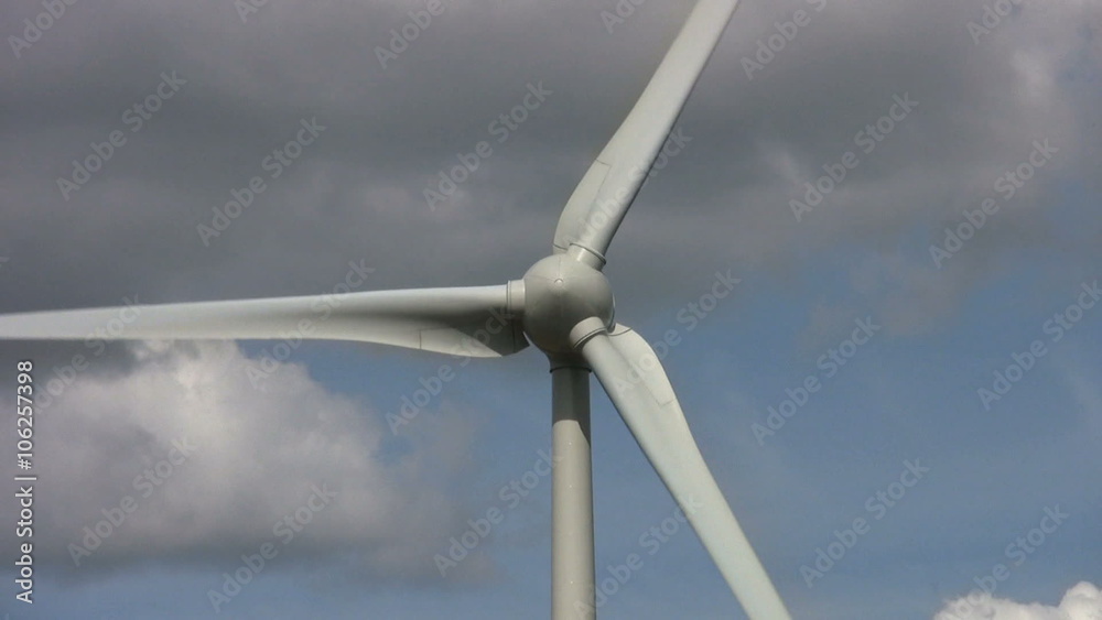 Zoom in to the sails of a wind turbine turning to generate electricity. An alternative renewable energy supply. Zoom in to the sails of a wind turbine turning to generate electricity. An alternative renewable energy supply.