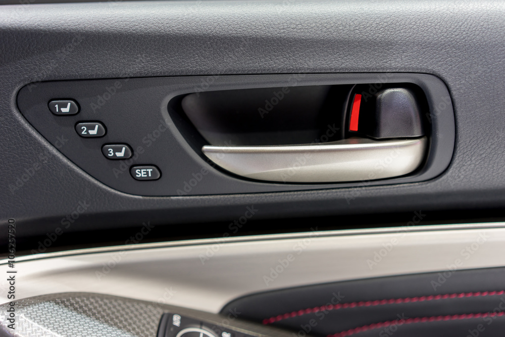 Detail of a car's door pictured from inside the vehicle