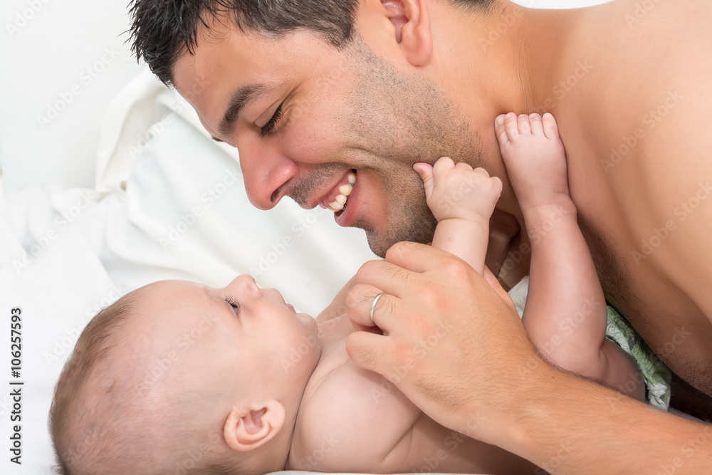 Father is playing with his baby Father is playing with his baby
