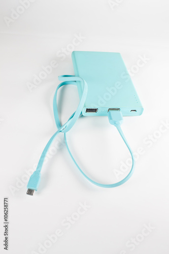 Portable power bank for charging mobile devices on the white bac