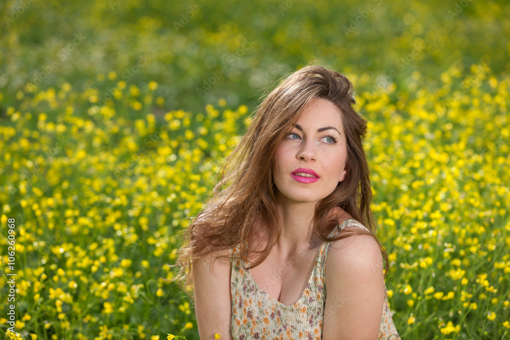 Beautiful young girl among yellow flowers Beautiful young girl among yellow flowers