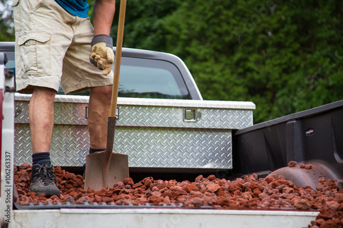 unloading lava stone from truck