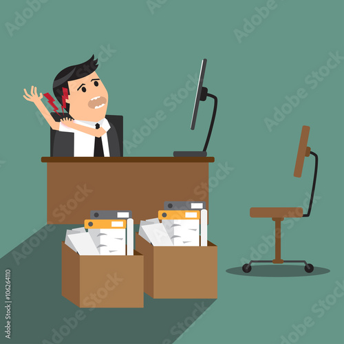 businessman having shoulder pain while working at computer desk