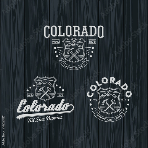 Колорадо штат Америки, стилизованные эмблемы на темном фоне