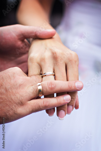 Men's and women's hands in wedding rings. Hands of the newly-weds