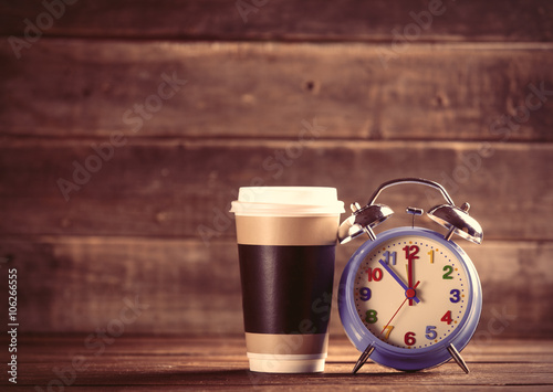 cup and clock on the table