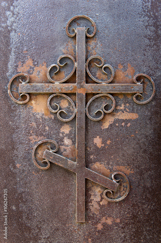 rusty iron cross . Putilov Church, an Orthodox Church in St. Petersburg , Russia
