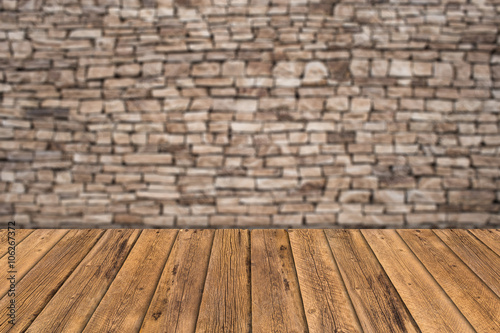 stone wall background with wooden slats floor