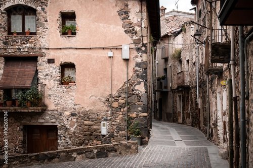 Deserted ancient street in medieval village Castellfollit de la Roca photo
