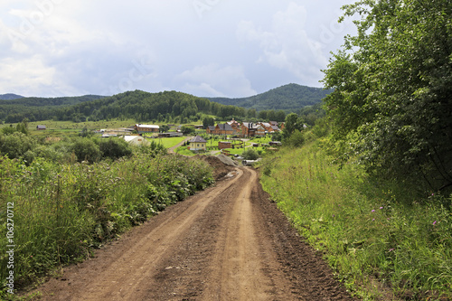 Dirt road to new village in Altai.