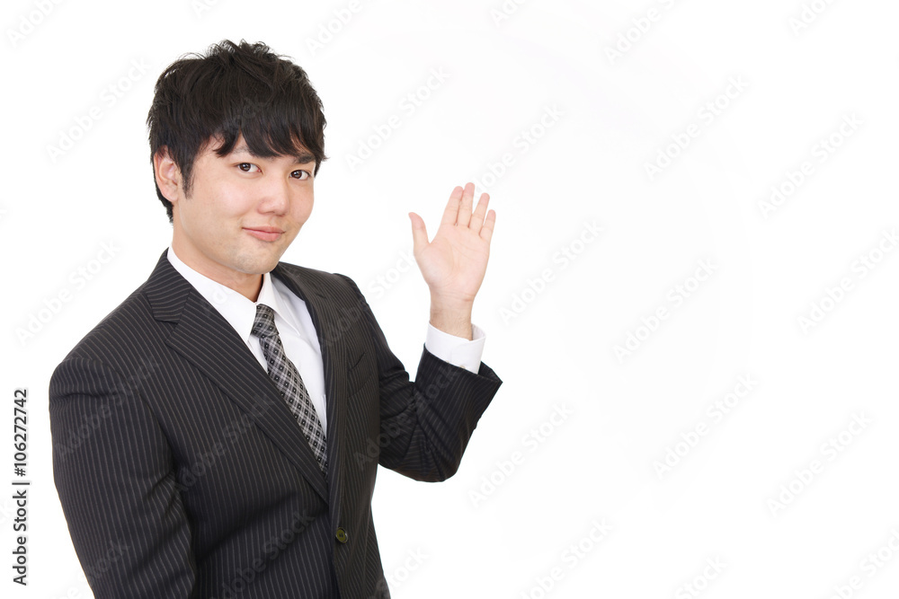 案内する笑顔のビジネスマン 案内する笑顔のビジネスマン