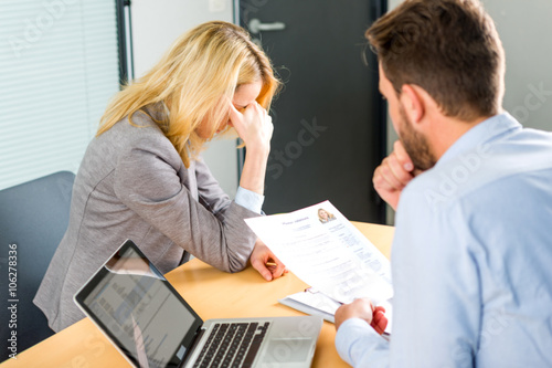 Young attractive woman upset during job interview