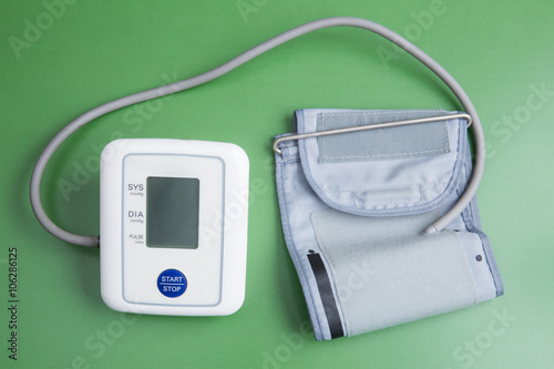 blood pressure gauge on green background