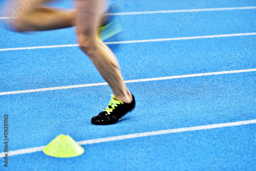 Blurred athlete feet on sprint track