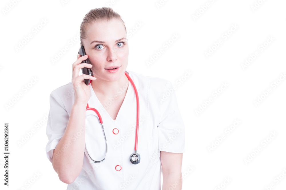 Doctor woman talking on the phone and acting surprised Doctor woman talking on the phone and acting surprised