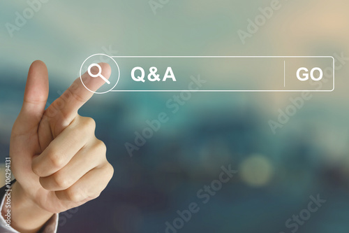 business hand clicking Q&A or Question and Answer button  photo