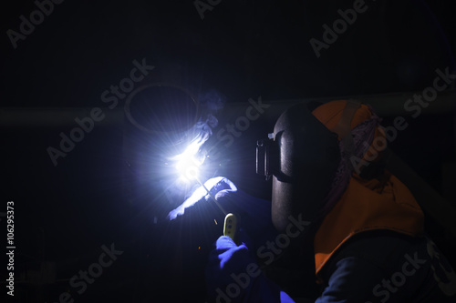 Worker welding pipes structure with welder machine