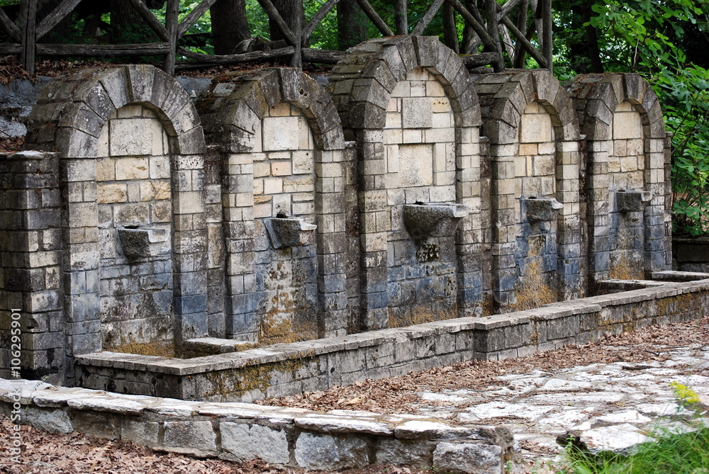 Old stone fountains in wood near Thessalonica in Greece.